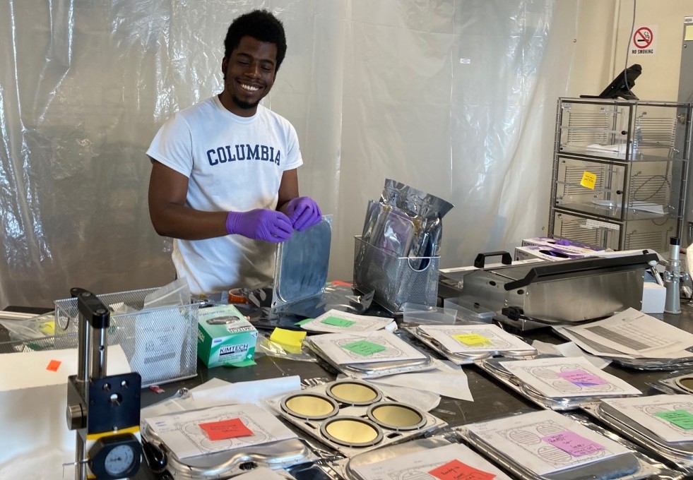 "Undergrad Ceaser Stringfield assembling detector modules for the GAPS dark matter search experiment."